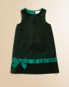 Doubling as a jumper over a blouse, this charming yet simple frock of plush velvet has shiny satin pleated trim at the hem.Round necklineSleevelessSlight A-line shapeHidden back zipperPleated satin trim with bowFully linedCottonMachine washImported