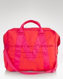MARC BY MARC JACOBS puts a surplus-inspired spin on the classic canvas tote. Boasting sturdy top handles and a tough-chic look, it's a commanding choice for travel. MARC BY MARC JACOBS puts a surplus-inspired spin on the classic canvas tote. Boasting sturdy top handles and a tough-chic look, it's a commanding choice for travel.
