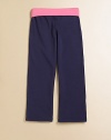 Fold-over waistband adds a pop of color to these soft stretch knit yoga pants.Stretch waistStraight legsCotton/Polyester/SpandexMachine washImported