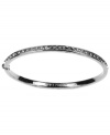 Polished and sleek. Givenchy's hematite-plated mixed metal bracelet features black glass stone detailing. Approximate diameter: 2-1/2 inches.