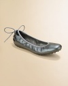 Silvery leather slip-on shoes with heel detail topped by an elastic ballerina bow.Leather upperElastic bow at heel detailPadded insoleLeather liningRubber soleImportedAdditional InformationKid's Shoe Size Guide (European Equivalent) 