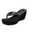 A most exquisite wedge. Nine West's Exceptional thong sandals help you put height and sparkle back into your life.