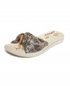 Strikingly comfortable. The reptilian print on DKNY Active's Kinder thong sandals adds glam to this walkable shoe.