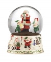 Trimmed in the Lenox Holiday pattern, this elaborate snow globe is an instant Christmas classic. Santa and two little helpers inside the globe race to get gifts ready while elves in the sculpted porcelain base fill bags and wagons to the brim. With festive color and gold detail.