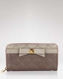 Marc Jacobs' quilted continental wallet is a girlish go-to. Fill it with your cash, cards and coins to keep the essentials stowed in lust-worthy fashion. Marc Jacobs' quilted continental wallet is a girlish go-to. Fill it with your cash, cards and coins to keep the essentials stowed in lust-worthy fashion.
