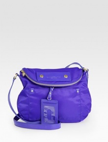 Lightweight nylon with leather accents in a soft frame with a zippered flap closure.Adjustable leather shoulder strap, 18-21 dropMagnetic snap flap closureOne zip pocket on flapOne outside open pocketRemovable leather luggage tagOne inside zip pocketTwo inside open pocketsSignature lining11½W X 11H X 3¼DImported Lightweight nylon with leather accents in a soft frame with a zippered flap closure.Adjustable leather shoulder strap, 18-21 dropMagnetic snap flap closureOne zip pocket on flapOne outside open pocketRemovable leather luggage tagOne inside zip pocketTwo inside open pocketsSignature lining11½W X 11H X 3¼DImported