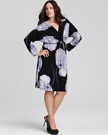 Gorgeous oversized blooms beautify the LBD. This Melissa Masse dress features a pretty front tie and blouson long sleeves.