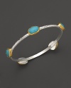 Turquoise stations in 24K yellow gold bring vibrant style to this hammered sterling silver bangle from Gurhan.