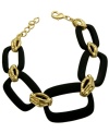 The Bamboo Collection from T Tahari is a breath of fresh air for your accessory collection. This chunky bracelet style combines black matte links with glass-accented bamboo stations for overall zen appeal. Set in gold-plated mixed metal. Approximate length: 7-1/2 inches + 1-inch extender.