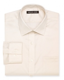 A classic Michael Kors non-iron dress shirt featuring a spread collar, barrel cuffs and a left chest pocket.