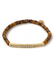 Follow your feline instincts and flaunt MICHAEL Michael Kors' tiger's eye bracelet--the fierce wristpiece lends exotic flair to staple tees or femme blouses.