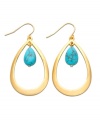 Memories of warm ocean waves, by Lauren by Ralph Lauren. Earrings feature sleek gold tone mixed metal teardrops with bright semi-precious reconstituted turquoise stones at center. Approximate length: 2 inches.