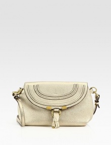 Metallic leather, crafted in a sleek flap silhouette with a versatile crossbody strap.Removable adjustable strap, 21¼-22½ dropFlap snap closureOne inside open pocketCanvas lining9¼W X 6H X 3DMade in Spain