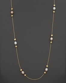 White and peach pearls create gleaming contrast with textured 18K yellow gold beads. From the Africa Pearl Collection.