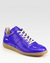 High-gloss, coated leather lace-ups make a statement.Lace-up frontLeather liningPadded insoleRubber soleMade in Italy