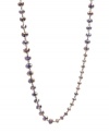 Lovely in lilac. Pale purple-hued faceted glass accents in small, medium and large shapes adorn this Kenneth Cole New York station necklace. Set in hematite tone mixed metal. Approximate length: 42-1/2 inches.