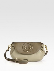 The perfect style for all your essentials, this leather design features a detachable crossbody strap and chic, drawstring detail.Detachable, adjustable shoulder strap, 19.5-21.5 dropMagnetic flap closureDrawstringRivet accented leather logo detailTwo inside open pocketsFully lined11W X 7H X 3DImported The perfect style for all your essentials, this leather design features a detachable crossbody strap and chic, drawstring detail.Detachable, adjustable shoulder strap, 19.5-21.5 dropMagnetic flap closureDrawstringRivet accented leather logo detailTwo inside open pocketsFully lined11W X 7H X 3DImported