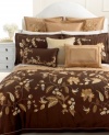 Embroidered loose bouquets and falling leaves embellish rich gold quilting for an ornate, artisan-inspired look.