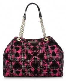 Bold, bright and unquestionably eye-catching, this take-anywhere tote from Betsey Johnson adds interest to everyday accessorizing. Golden chain-link straps and signature hadrware play up the pretty pattern, while the spacious interior holds all your daily essentials without a worry. Bold, bright and unquestionably eye-catching, this take-anywhere tote from Betsey Johnson adds interest to everyday accessorizing. Golden chain-link straps and signature hadrware play up the pretty pattern, while the spacious interior holds all your daily essentials without a worry.