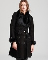 A Burberry London leather trench features shearling trim and accents, making it the sumptuous layering piece of the season. A worthy investment, it moves through the season in decadent style, as gorgeous over denim as it is over a cocktail dress.