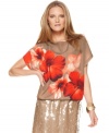 A bright burst of flowers make a bold spring statement on this Vince Camuto top -- pair it with skinny jeans or a skirt!