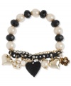 Charm your heart. Betsey Johnson's bracelet highlights black faceted beads and glass pearls on a half-stretch chain. Features a crystal cup chain accent, black heart with black-colored crystal accents, gold tone bubble hearts, crystal fireball bead and gold tone flower charm. Set in gold tone mixed metal. Approximate length: 7-1/2 inches.