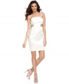 Calvin Klein's sleek dress is made special occasion-ready with chic spaghetti straps and beaded bands at the waist.