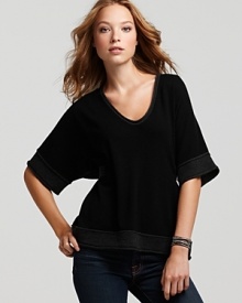 This Michael Stars poncho sweater features a waist-cinching tie and wide sleeves borrowed from the classic kimono. This Michael Stars poncho sweater features a waist-cinching tie and wide sleeves borrowed from the classic kimono.
