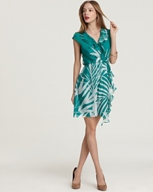 A palm-leaf print brings tropical chic while a cascading ruffle lends feminine flair to this Milly wrap dress of supple silk.