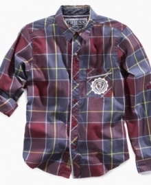 He can roll up his sleeves and get down to the business of looking good with this plaid shirt from Guess. He can roll up his sleeves and get down to the business of looking good with this plaid shirt from Guess.