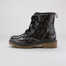 Trendy and tough, these girls'combat boots are a fashionable take on a classic design. They feature a lace-up front, side zip entry, shiny PU lace print upper and gum rubber outsole. Imported. Trendy and tough, these girls'combat boots are a fashionable take on a classic design. They feature a lace-up front, side zip entry, shiny PU lace print upper and gum rubber outsole. Imported.