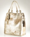 Give a luxe look to your everyday accessorizing with this chic, metallic suede tote from Lauren Ralph Lauren. Golden buckles adorn the slender straps, while laced detail stitching, signature hardware and flirty side tassels add extra allure.