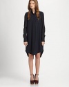 Tap into the minimalist mood with this relaxed wool-rich shirtdress, emboldened by a stand collar, oversized patch pocket and shirttail hem. Stand collarButton frontLong sleeves with buttoned cuffsSingle front patch pocketShirttail hem with back slitAbout 22 from natural waist96% wool/4% LycraDry cleanImportedModel shown is 5'7 (174cm) wearing US size 2.This style runs large. We recommend ordering one size down for a standard fit. 