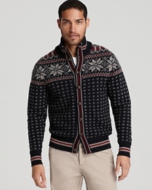Kick back at the ski lodge in this cool retro sweater, adorned with snowflake weave and polka dots, with a button down closure and contrast stripe trim. Kick back at the ski lodge in this cool retro sweater, adorned with snowflake weave and polka dots, with a button down closure and contrast stripe trim.