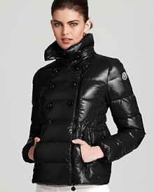 Moncler's lacquered Daim coat boasts a forward asymmetrical zip front and a decorative, double breasted silhouette.