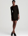 A ladylike DIANE von FURSTENBERG lace dress is ever-so chic for cocktails with an alluring v back and chic scalloped trim.