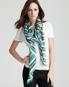 A large lightweight scarf with thick stripe print and self fringe edges.