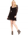 A back cutout adds eye-catching appeal to this Free People lace dress for a flirty, feminine look!