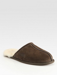 Warm, comfortable suede slip-ons are fully lined in sheepskin with a sheepskin sockliner that naturally wicks away moisture and helps keep feet dry. Lightweight sueded rubber outsole with embossed logo Imported