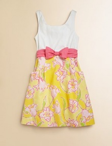 A full skirt with cheery floral detail and a cinched bow and sash waistline define this sunny frock.ScoopneckSleevelessBack zipperFitted bodiceWaistband sash with bowFlat front pocketsFull skirtCottonMachine washImported A full skirt with cheery floral detail and a cinched bow and sash waistline define this sunny frock.ScoopneckSleevelessBack zipperFitted bodiceWaistband sash with bowFlat front pocketsFull skirtCottonMachine washImported