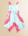 A groovy tie dye design takes this cotton frock from everyday causal to out of this world cool.V-neckTwisted strapsElastic empire waistUneven pointed hemCottonMachine wash coldMade in the USA