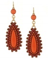 A bold pair of statement earrings will instantly upgrade any ensemble. This vibrant design from Jessica Simpson features large plastic coral teardrop shapes with bronze accents. Approximate drop: 3-1/2 inches.