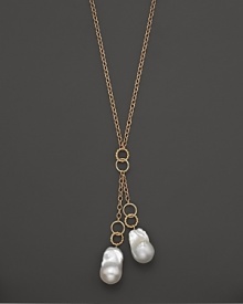 Boldly gleaming baroque freshwater pearls add rich luster to 14K yellow gold. By Nancy B. Boldly gleaming baroque freshwater pearls add rich luster to 14K yellow gold. By Nancy B.