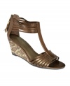 Strappy sophistication gets a boost from a sleek wedge. Bandolino's Jopa wedges are your new summer neutral.