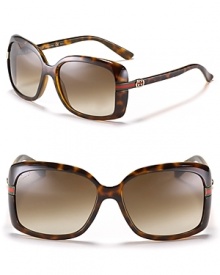 Glam it up in Gucci. Oversized rectangle sunglasses with signature stripe and logo detail at temples.