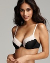 An elegant demi bra with underwire cups and tonal floral lace trim.