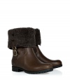 Mix utilitarian style and effortless chic with these leather boots from UGG Australia- Round toe, rugged rubber sole, tonal shearling cuff, ankle length, side zip closure - Pair with skinny jeans, an oversized cashmere sweater, and a down jacket or wool cape