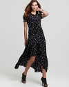 A fresh take on a retro silhouette, this ABS by Allen Schwartz printed dress features charming oversize buttons and a dramatic elongated hem.
