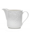 Taste of the country. Hardy stoneware embossed with a fruit and flora motif makes the English Country creamer a graceful go-to for every day.