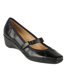 A stylish Mary Jane silhouette adds fashionable flair to Naturalizer's casual Lola wedges. A low heel, square-toe silhouette and adjustable velcro closure on the vamp provide plenty of comfort and support. A stylish Mary Jane silhouette adds fashionable flair to Naturalizer's casual Lola wedges. A low heel, square-toe silhouette and adjustable velcro closure on the vamp provide plenty of comfort and support.